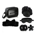 Giftplug 6-piece black beauty travel set including a washbag, silk bonnet, sleep mask, headband, scrunchies, and clip.