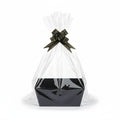 Giftplug decorative black gift basket with clear cellophane wrapping and a black and gold bow on a white background.