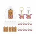 Giftplug butterfly keychain party favors in pink and purple with gold and silver rings, organza bags, and thank you tags