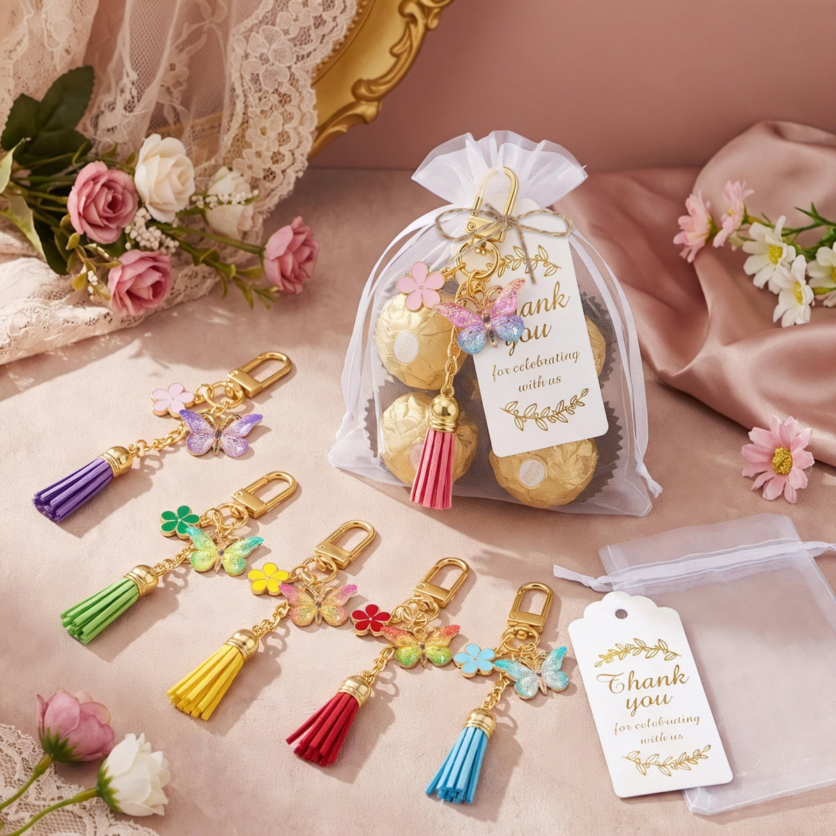 Giftplug butterfly keychain party favor set with colorful enamel charms, soft tassels, and thank you gift tags.