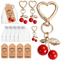 Giftplug cherry heart-shaped keychains with gold clasps, organza gift bags, and thank you tags for party favors.
