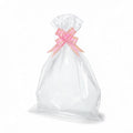 Giftplug clear cellophane gift bag featuring a decorative pink bow with gold-tone accents for elegant gift wrapping.