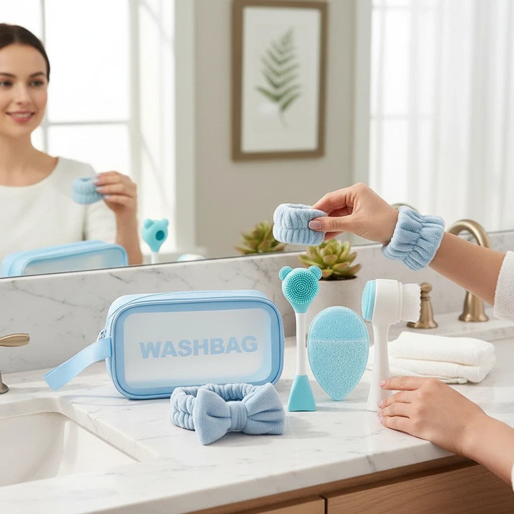 Giftplug 6-piece blue facial skincare set with bow headband, wristbands, cleansing brushes, and transparent washbag.
