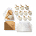 Giftplug heart-shaped pearl keychains with gold hardware, white organza gift bags, and kraft paper thank you tags.
