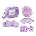 Giftplug lavender beauty travel set with clear wash bag, plush bow headband, satin sleep mask, scrunchies, and clip.