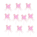 Giftplug light pink ribbon bows with jewel centers and stems for elegant gift wrapping and party decorations.