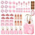 Giftplug 50-piece pink spa and beauty gift set including scrunchies, brushes, makeup sponges, and gift bags.