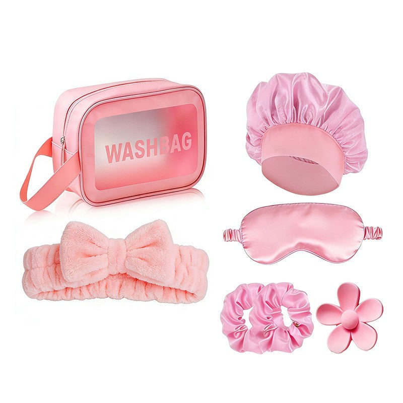 Giftplug 6-piece pink beauty travel set with plush bow headband, satin sleep mask, bonnet, scrunchies, and washbag.