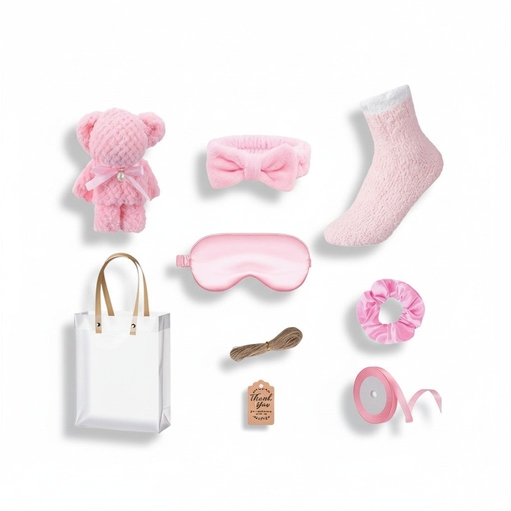 Giftplug pink plush spa gift set with teddy bear, sleep mask, headband, fuzzy socks, scrunchie, and gift bag.