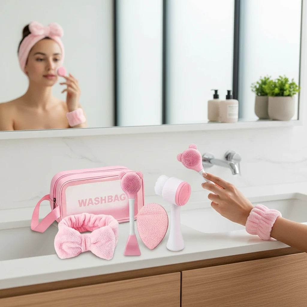 Giftplug 6-piece pink skincare set with bow headband, wristbands, cleansing brushes, and a transparent washbag.