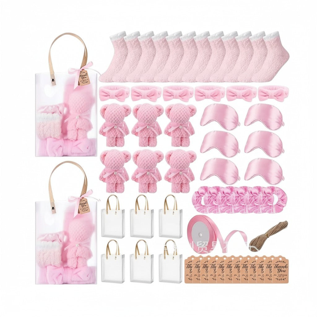 Giftplug bulk spa party favor set with pink fuzzy socks, bear washcloths, satin sleep masks, and gift bags.
