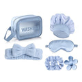 Giftplug 6-piece sky-blue beauty set with wash bag, plush bow headband, satin sleep mask, shower cap, and hair ties.