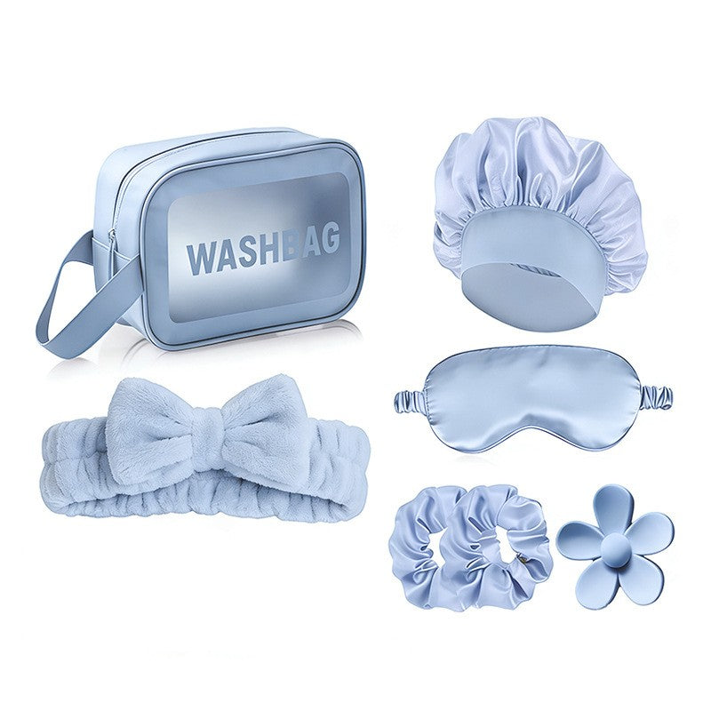 Giftplug 6-piece sky-blue beauty set with wash bag, plush bow headband, satin sleep mask, shower cap, and hair ties.